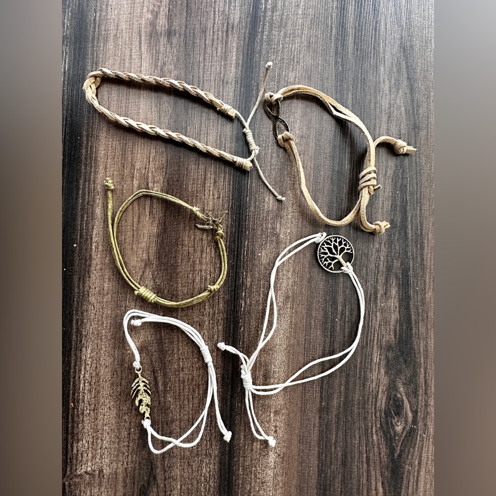 Lot of woven boho style tan and cream bracelets with metal details